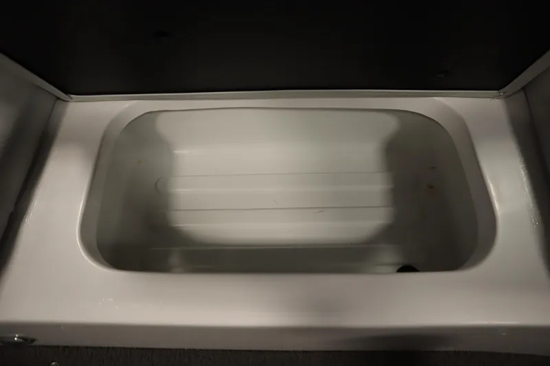 Slide: The Image of 2008 Moomba Outback V storage compartment, empty and clean, with a white interior. - 38