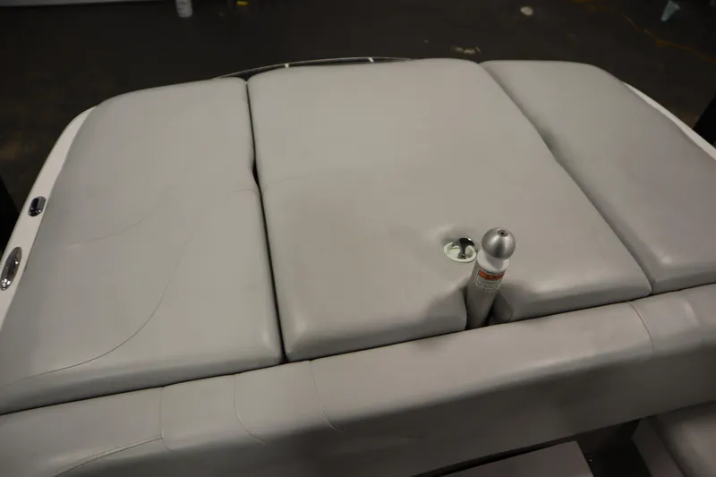 Slide: The Image of 2008 Moomba Outback V boat with gray cushioned seating and metal fixture. - 41