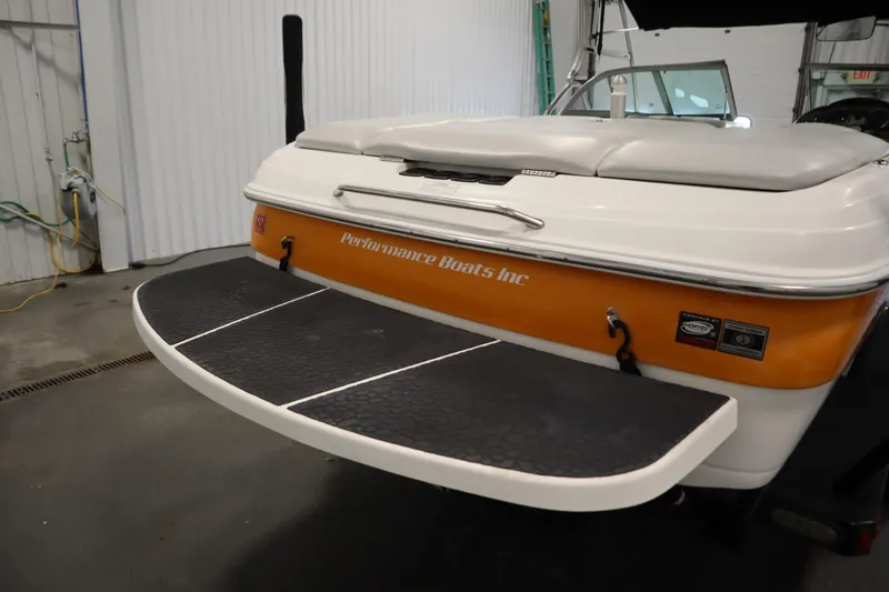 Slide: The Image of 2008 Moomba Outback V boat rear view with swim platform in a garage. - 47
