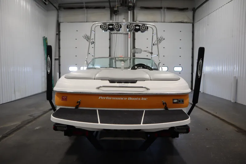 Slide: The Image of 2008 Moomba Outback V boat in a garage, rear view with wakeboard tower. - 6