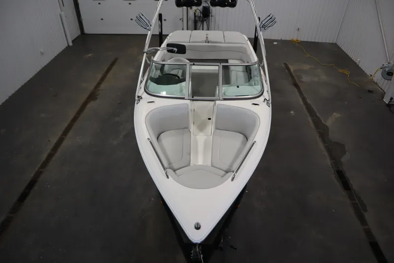 Slide: The Image of 2008 Moomba Outback V boat in a garage, top view of bow seating area. - 9