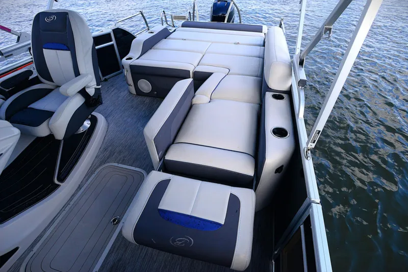 Slide: The Image of 2022 Barletta Corsa 25U pontoon boat interior with luxurious seating and cup holders. - 15