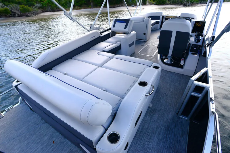 Slide: The Image of 2022 Barletta Corsa 25U pontoon boat interior with luxurious seating and modern design. - 17
