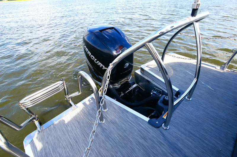 Slide: The Image of 2022 Barletta Corsa 25U boat with Mercury outboard motor on water. - 25