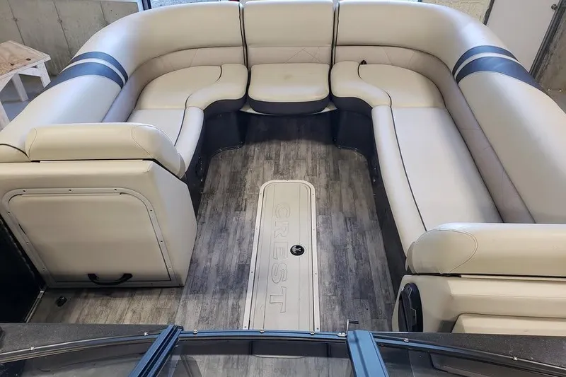 Slide: The Image of Luxurious seating on 2021 Crest Continental 250 SLS pontoon boat, featuring elegant interior design. - 9