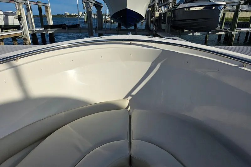 Slide: The Image of 2012 Pursuit C 310 Center Console boat interior with cushioned seating. - 10