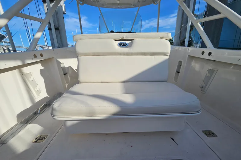 Slide: The Image of 2012 Pursuit C 310 Center Console boat interior with cushioned seating. - 20