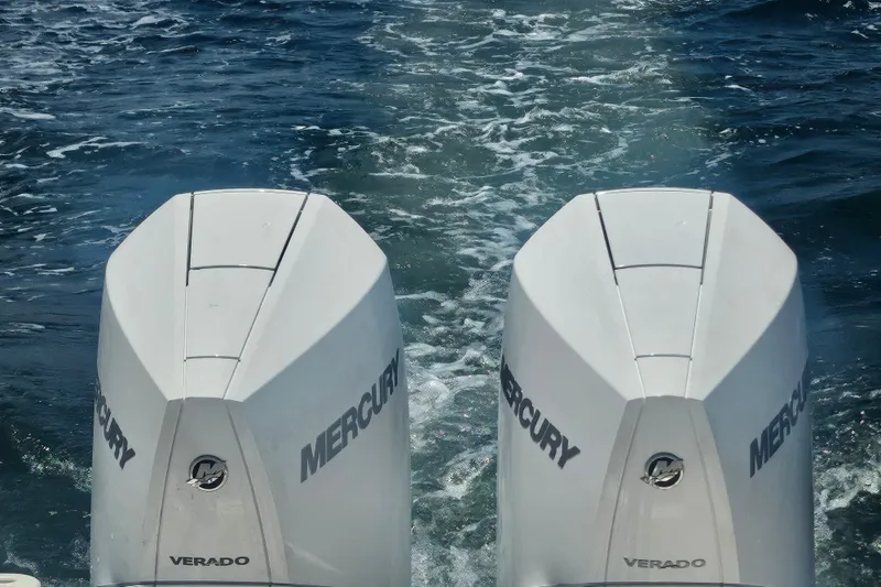 Slide: The Image of Twin Mercury Verado engines on a 2012 Pursuit C 310 Center Console boat. - 3