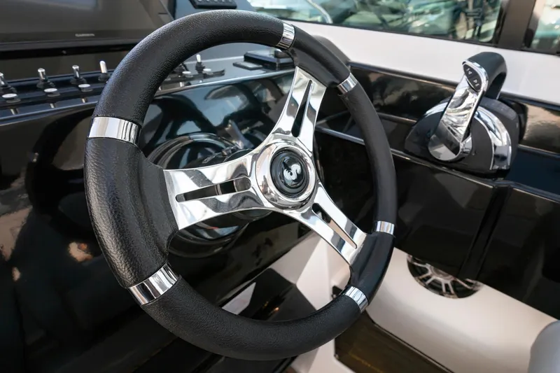 Slide: The Image of Steering wheel and controls of 2026 Beneteau Flyer 10 Sport Top boat. - 10