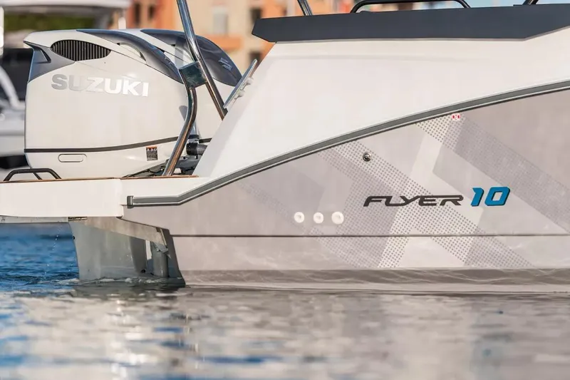 Slide: The Image of 2026 Beneteau Flyer 10 Sport Top with Suzuki engine on water. - 5