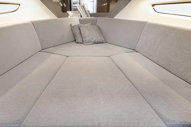 Slide: The Image of Manufacturer Provided Image: 2026 Beneteau Flyer 10 Sport Top interior with spacious, modern seating and cushions. - 7