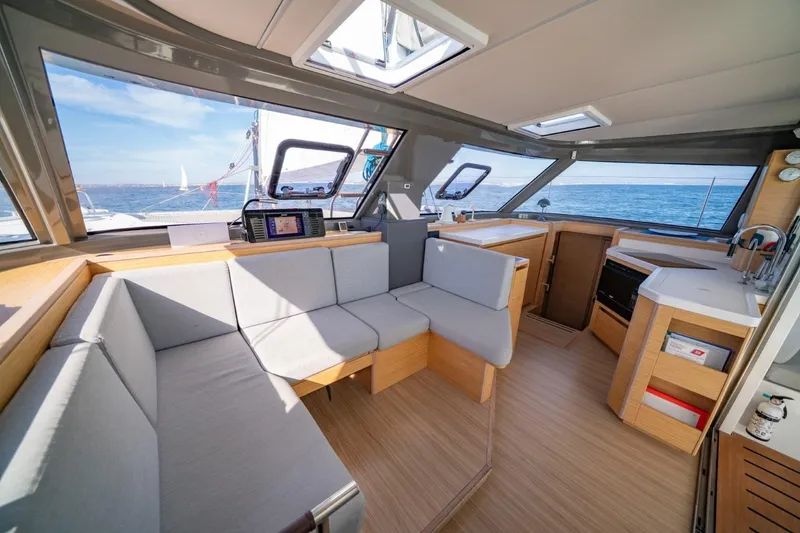 Slide: The Image of Interior of 2020 Nautitech 40 Open catamaran with modern seating and ocean view. - 18