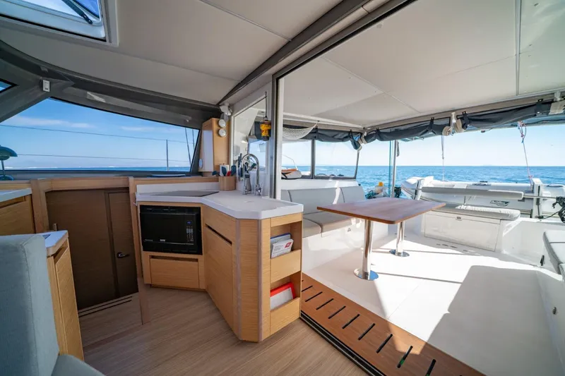 Slide: The Image of Interior of 2020 Nautitech 40 Open catamaran with modern kitchen and ocean view. - 19