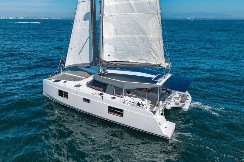 Slide: The Image of Sailing catamaran Nautitech 40 Open 2020 gliding on blue ocean waters. - 2