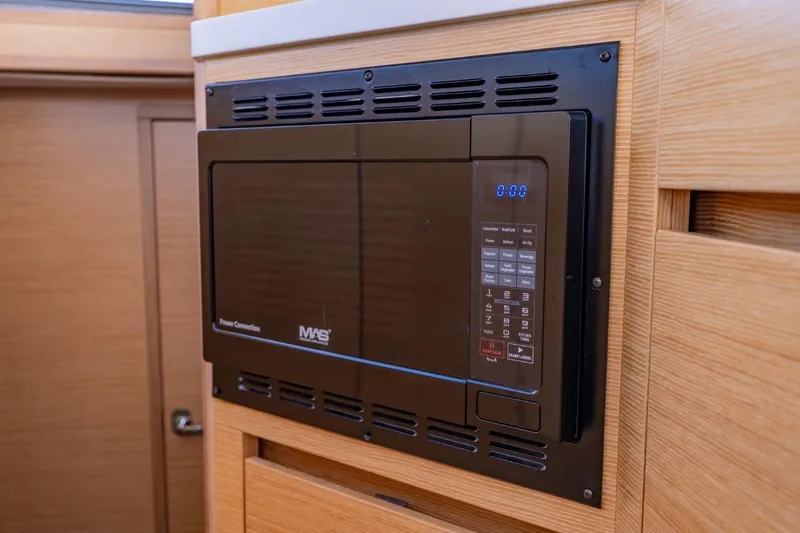 Slide: The Image of Built-in microwave in 2020 Nautitech 40 Open yacht kitchen. - 24