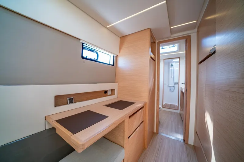 Slide: The Image of Modern interior of 2020 Nautitech 40 Open catamaran, featuring sleek wood finishes and compact design. - 28