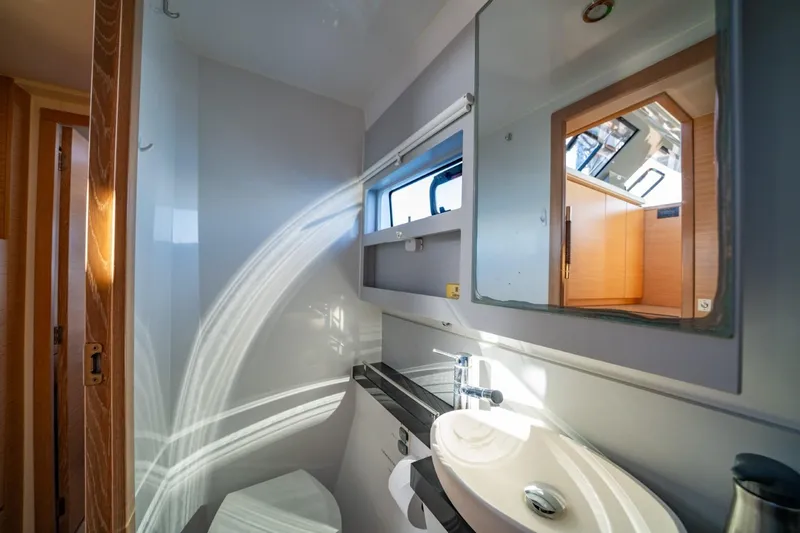 Slide: The Image of Modern bathroom interior of 2020 Nautitech 40 Open catamaran, featuring sleek design and natural light. - 36