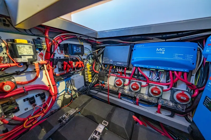 Slide: The Image of Electrical system of a 2020 Nautitech 40 Open catamaran, featuring wiring and control panels. - 41