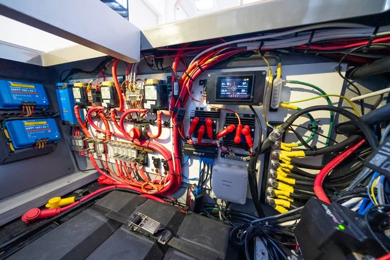 Slide: The Image of Electrical system of a 2020 Nautitech 40 Open catamaran, featuring wiring and control panels. - 42