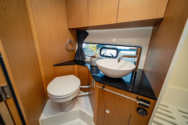 Slide: The Image of 2024 Beneteau Flyer 10 bathroom with modern sink and toilet. - 13