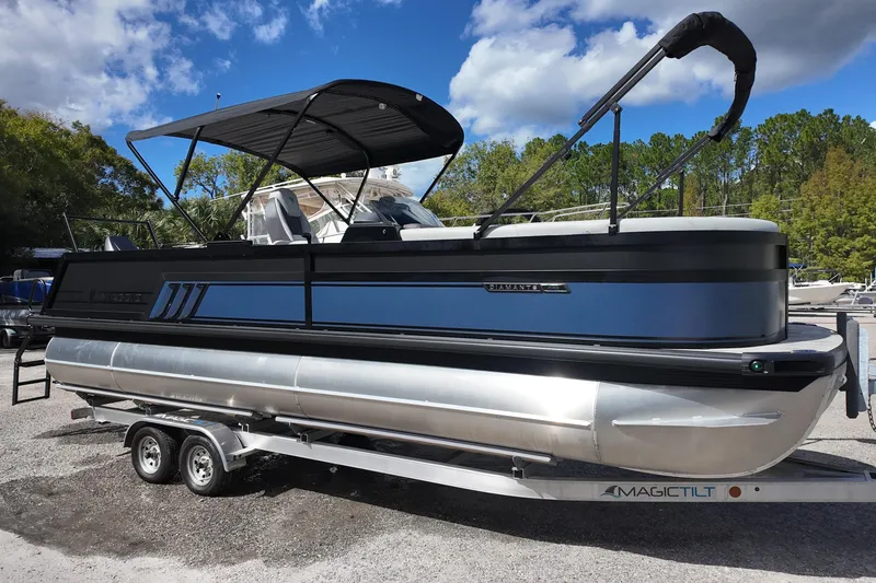 The Image of 2026 Viaggio Diamante 24S pontoon boat on trailer, under blue sky. - 0