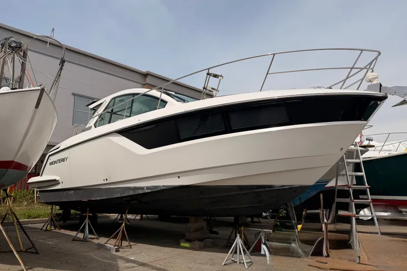 Slide: The Image of 2018 Monterey 360 Sport Coupe boat on dry dock, side view. - 4