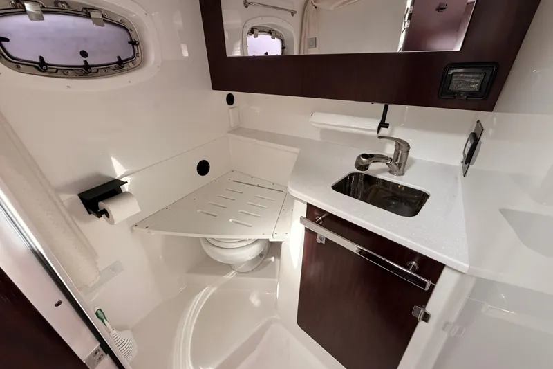 Slide: The Image of Luxurious 2018 Monterey 360 Sport Coupe bathroom with sink, toilet, and modern fixtures. - 32