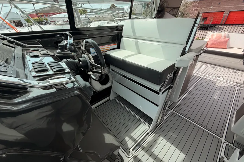 Slide: The Image of Interior of 2018 Monterey 360 Sport Coupe with sleek helm and seating. - 13