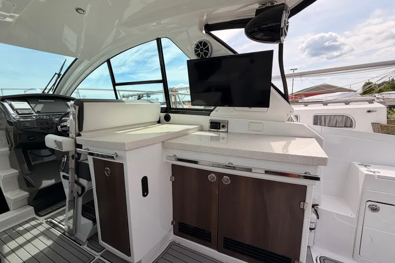 Slide: The Image of Interior of 2018 Monterey 360 Sport Coupe with modern helm and entertainment area. - 24
