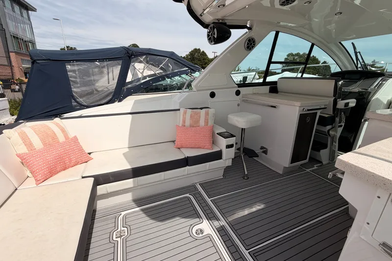 Slide: The Image of 2018 Monterey 360 Sport Coupe interior with seating, cushions, and modern design elements. - 16