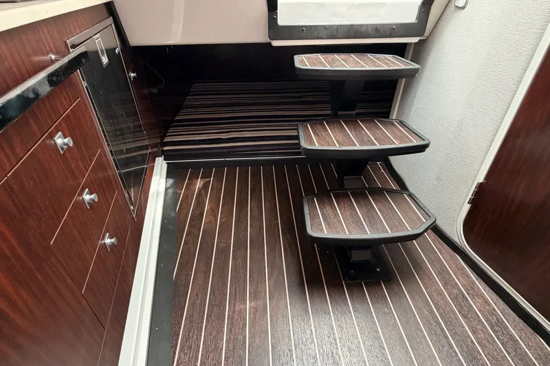 Slide: The Image of Interior of 2018 Monterey 360 Sport Coupe with wooden flooring and modern cabinetry. - 26