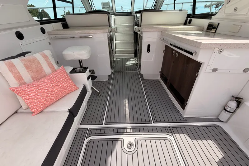 Slide: The Image of Interior of a 2018 Monterey 360 Sport Coupe boat with modern seating and sleek design. - 15