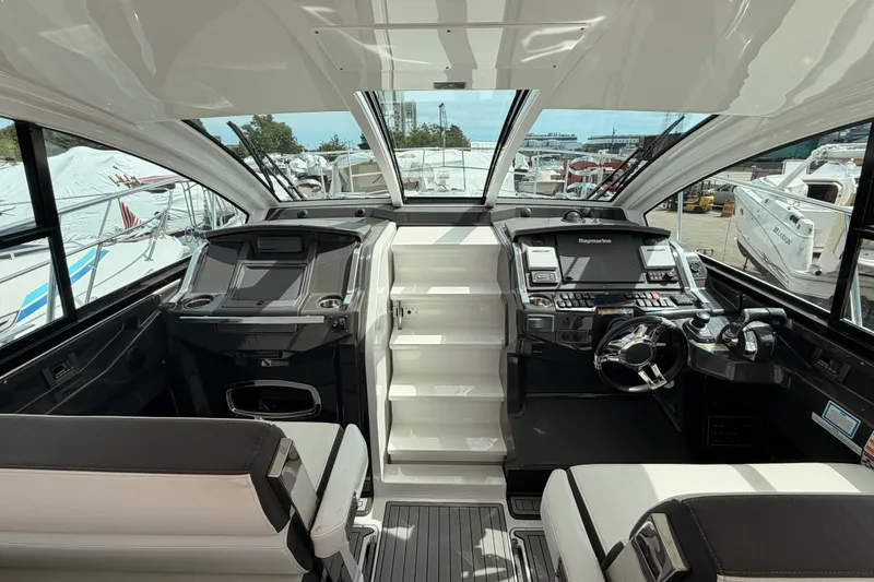 Slide: The Image of Interior view of 2018 Monterey 360 Sport Coupe yacht cockpit with modern controls. - 23