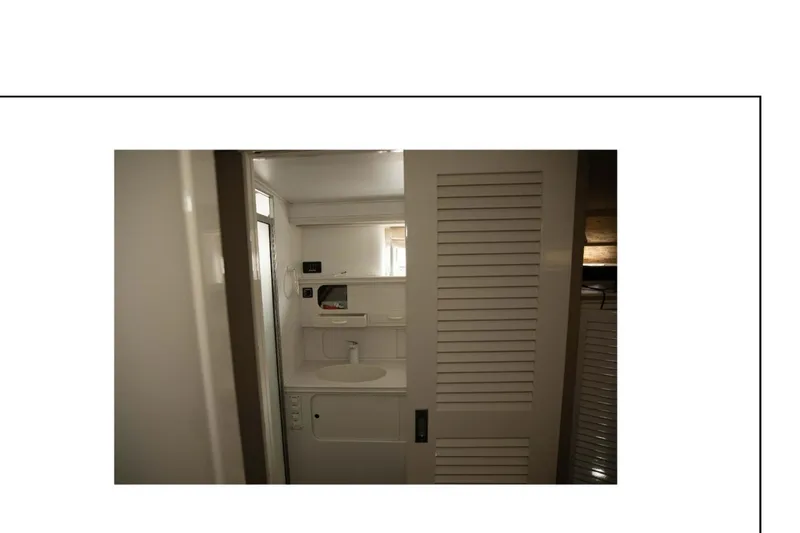 Slide: The Image of Interior cabin of 1977 Hatteras 58 Yacht Fisherman with bed and storage. - 10