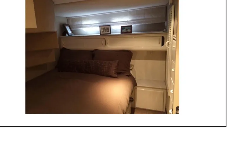 Slide: The Image of 1977 Hatteras 58 Yacht Fisherman bathroom interior with sink and storage. - 11