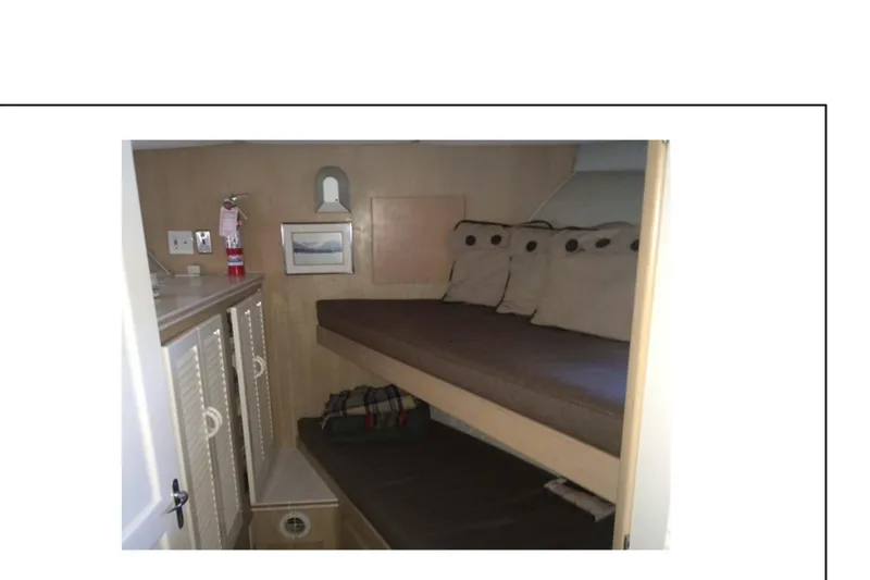 Slide: The Image of 1977 Hatteras 58 Yacht Fisherman bathroom with sink, mirror, and shower. - 14