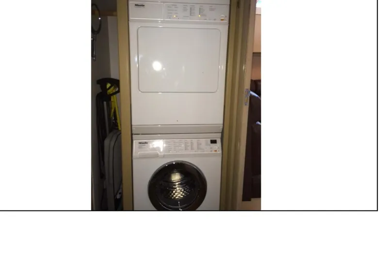 Slide: The Image of 1977 Hatteras 58 Yacht Fisherman cabin with bunk beds and storage. - 15