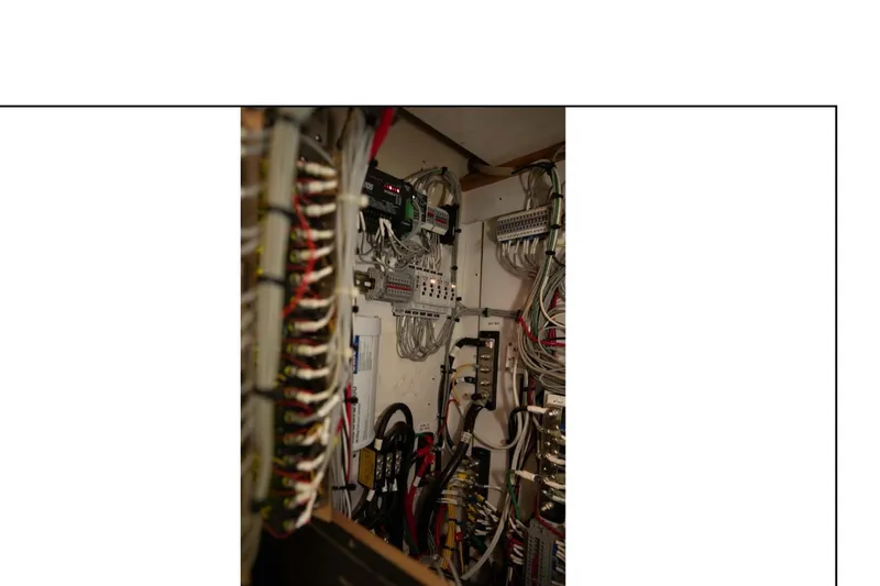 Slide: The Image of Electrical wiring panel inside a 1977 Hatteras 58 Yacht Fisherman. - 20