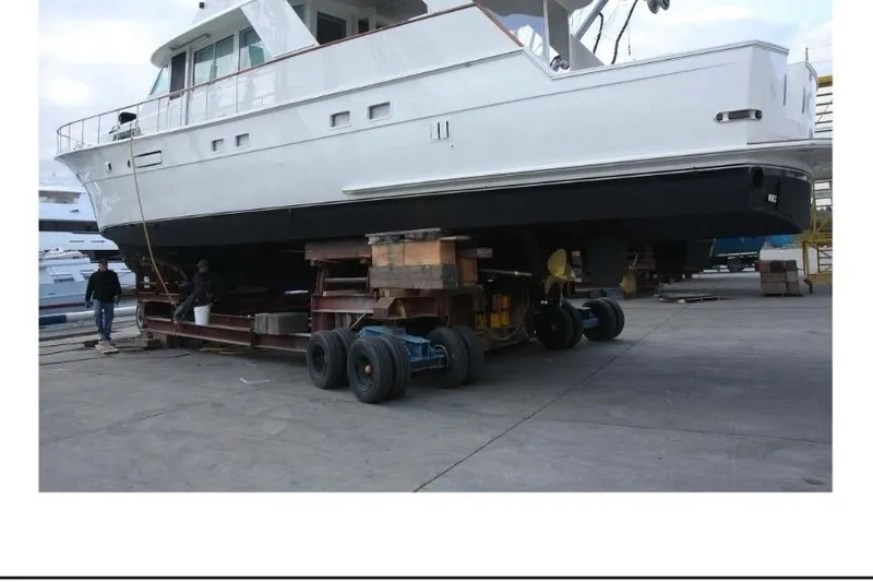 Slide: The Image of 1977 Hatteras 58 Yacht Fisherman on trailer for maintenance at shipyard. - 3