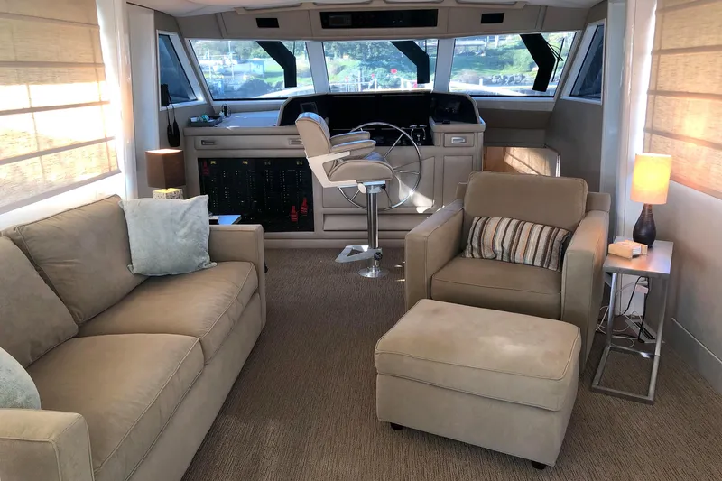 Slide: The Image of Interior of 1977 Hatteras 58 Yacht Fisherman, featuring cozy seating and elegant decor. - 6