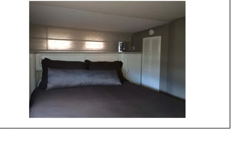 Slide: The Image of 1977 Hatteras 58 Yacht Fisherman interior with staircase and hallway view. - 9