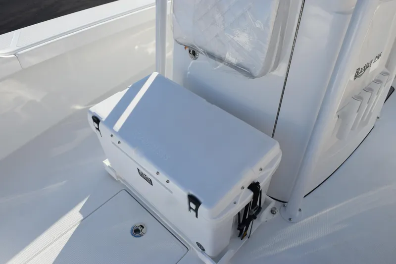 Slide: The Image of 2026 BlackJack 256 Coastal boat interior with cooler and seating area. - 11