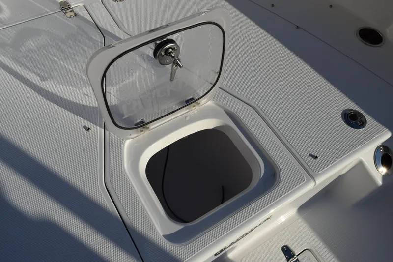 Slide: The Image of Open hatch on 2026 BlackJack 256 Coastal boat deck, showcasing storage compartment. - 12