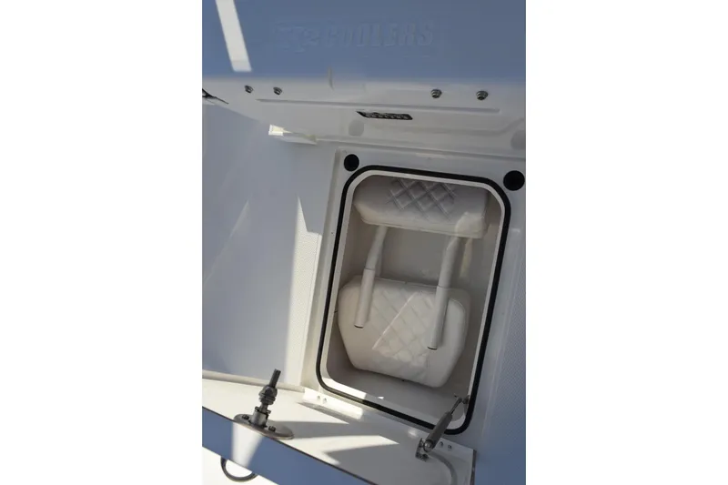 Slide: The Image of Storage compartment in 2026 BlackJack 256 Coastal boat, featuring a padded interior. - 14