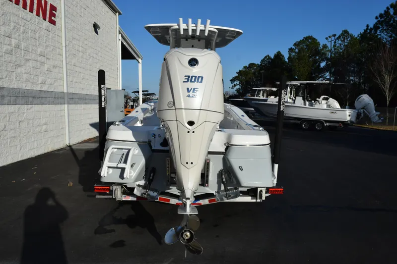Slide: The Image of 2026 BlackJack 256 Coastal boat with powerful 300 VE engine, parked outdoors. - 5