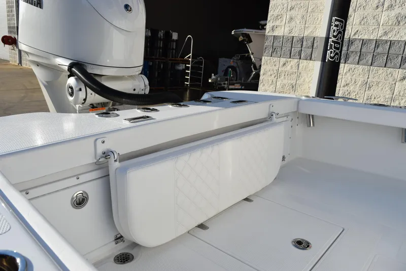 Slide: The Image of 2026 BlackJack 256 Coastal boat interior with Yamaha engine, featuring foldable seating and storage. - 7