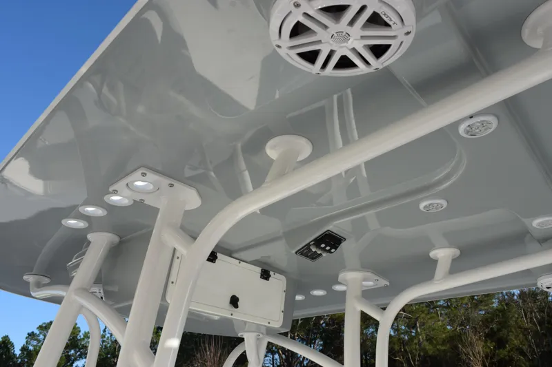 Slide: The Image of 2026 BlackJack 256 Coastal boat T-top with integrated speakers and lighting. - 9