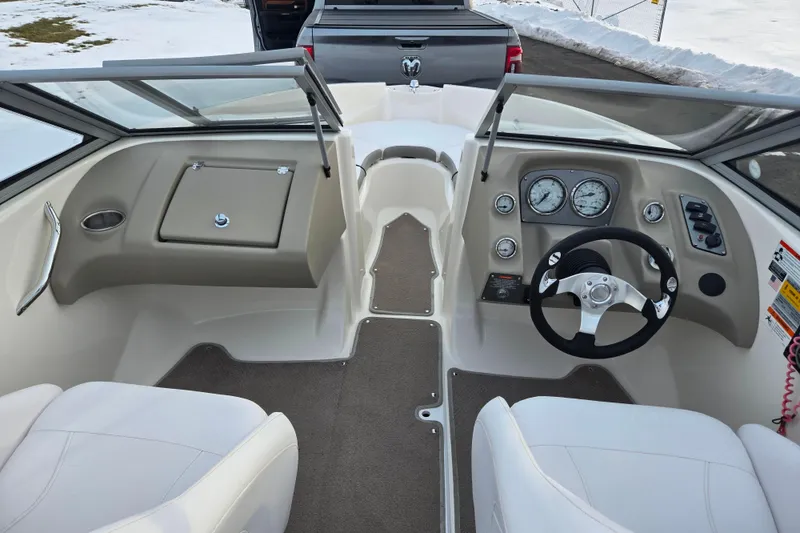 Slide: The Image of Interior view of 2011 Larson LX 850 boat cockpit with steering wheel and dashboard. - 11