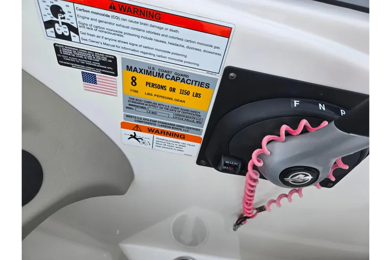 Slide: The Image of 2011 Larson LX 850 boat control panel with safety warnings and capacity limits. - 15