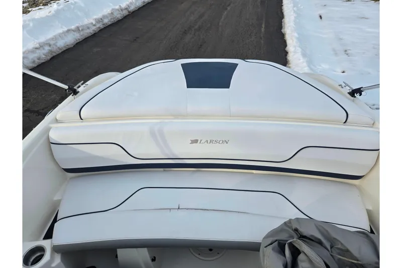 Slide: The Image of 2011 Larson LX 850 boat interior with white seating and black trim. - 20